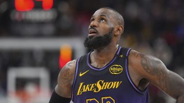 Los Angeles Lakers forward LeBron James looks toward the scoreboard during the second half of an NBA basketball game against the Los Angeles Clippers, Sunday, Jan. 19, 2025, in Inglewood, Calif. (AP Photo/Mark J. Terrill)