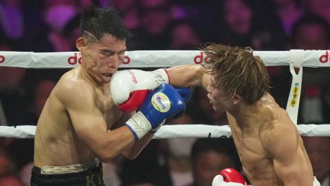 Japanese champion Naoya Inoue, right, punches South Korea challenger Ye Joon Kim in the fourth round of a boxing match for the unified WBC IBF and WBO super bantamweight world title at the Ariake Arena in Tokyo, Friday, Jan. 24, 2025. (AP Photo/Hiro Komae)