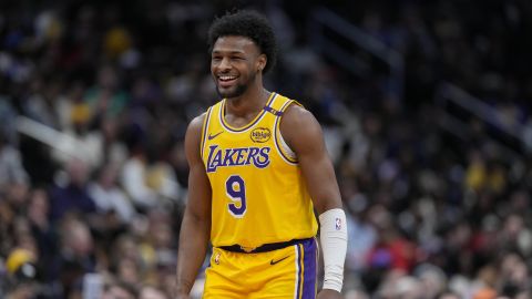 Los Angeles Lakers guard Bronny James (9) smiles after the team scores against the Washington Wizards during the second half of an NBA basketball game Thursday, Jan. 30, 2025, in Washington. (AP Photo/Jess Rapfogel)