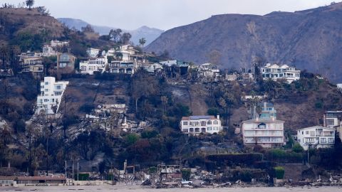 Properties damaged by the Palisades Fire are seen from a coastline perspective Friday, Jan. 17, 2025 in Malibu, Calif. (AP Photo/Carolyn Kaster)