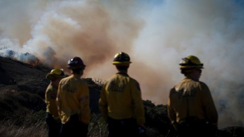 Fire crews monitor the Palisades Fire in the outskirts of the Pacific Palisades neighborhood of Los Angeles, Friday, Jan. 10, 2025. (AP Photo/Eric Thayer)