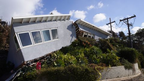 A home split in half by a mud slide caused by running water in the hills in the Pacific Palisades neighborhood of Los Angeles is shown on Friday, Jan.17, 2025. (AP Photo/Richard Vogel)