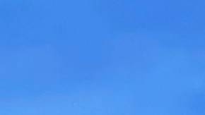 A large plume of smoke caused by the Hughes Fire rises from Castaic Lake as seen from a neighborhood of Santa Clarita, Calif., Wednesday, Jan. 22, 2025. (AP Photo/Marcio Jose Sanchez)