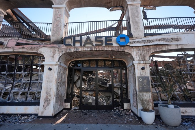 A Chase Bank branch destroyed by the Palisades Fire is seen in the Pacific Palisades neighborhood of Los Angeles, Monday, Jan. 13, 2025. (AP Photo/Richard Vogel)
