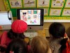 In this June 3, 2010 photo, first-graders get hands-on experience with a computer at Wonderland Avenue Elementary School in the Hollywood Hills area of Los Angeles. Wonderland Avenue Elementary School and Edwin Markham Middle School have been highlighted as the Los Angeles Unified School District has grappled with $1.5 billion in budget cuts and nearly 3,000 teacher layoffs during the past two years. But comparing the two schools shows a remarkably uneven impact, and just how much depends on factors ranging from income and parent involvement to teacher tenure. (AP Photo/Reed Saxon)