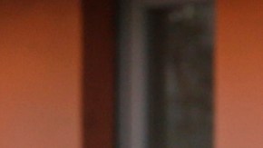 FILE - In this March 25, 2020, file photo, the Gomez family twin girls, with their mother from Oaxaca, Mexico, middle, pick up "Grab & Go" meals provided by the Los Angeles Unified District at the Robert F. Kennedy Community School station in Los Angeles. Amid spiking coronavirus cases, Los Angeles Unified School District campuses will remain closed when classes resume next month, Superintendent Austin Beutner said Monday, July 13, 2020, defying President Donald Trump's demand that students return to in-person instruction. (AP Photo/Damian Dovarganes, File)