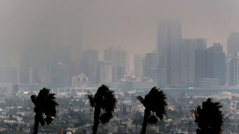 High winds blow as thick smoke from wildfires shrouds downtown Los Angeles on Wednesday, Jan. 8, 2025. (AP Photo/Richard Vogel)