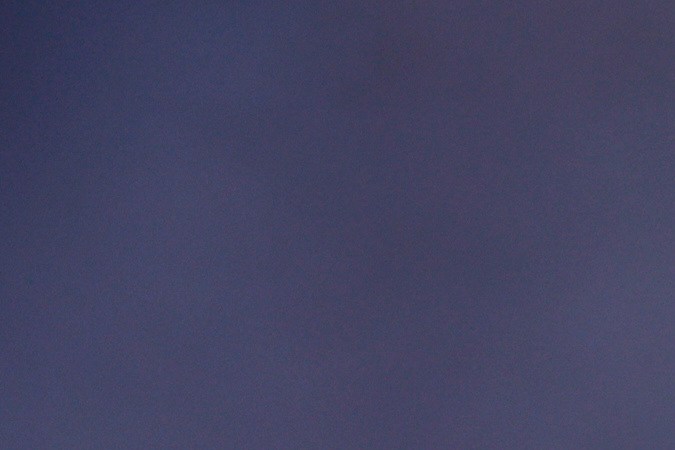 Water is dropped by helicopter on the advancing Palisades Fire in the Pacific Palisades neighborhood of Los Angeles, Tuesday, Jan. 7, 2025. (AP Photo/Etienne Laurent)