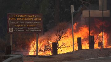 Flames caused by the Hughes Fire is seen along Castaic Lake in Castaic, Calif., Wednesday, Jan. 22, 2025. (AP Photo/Marcio Jose Sanchez)