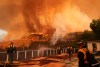 Fire crews monitor the Palisades Fire in Mandeville Canyon Saturday, Jan. 11, 2025, in Los Angeles. (AP Photo/Jae C. Hong)
