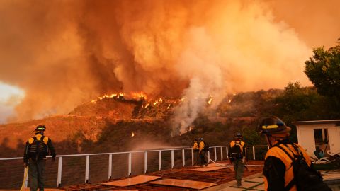 Fire crews monitor the Palisades Fire in Mandeville Canyon Saturday, Jan. 11, 2025, in Los Angeles. (AP Photo/Jae C. Hong)