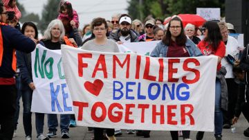 In this photo taken Wednesday, July 17, 2019, Jose Robles, center in white hat, walks with supporters before he presented himself to U.S. Immigration and Customs Enforcement officials in Tukwila, Wash. The prospect of nationwide immigration raids has provided evidence that legions of pastors, rabbis and their congregations stand ready to help vulnerable immigrants with offers of sanctuary and other services. (AP Photo/Elaine Thompson)