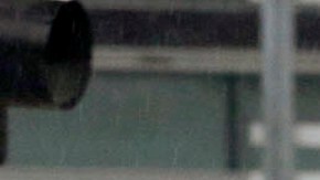 Commuters walk under a light rain downtown in Los Angeles on Wednesday, Feb. 17, 2016, as a storm system arriving in California ends days of clear skies, blazing sunshine and record-setting heat. The National Weather Service said the storm would arrive in Southern California by night, bringing gusty winds to the mountains and passes along with rain and snow through Thursday morning. (AP Photo/Nick Ut)