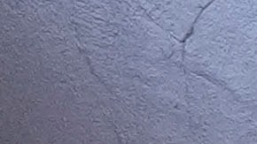 A woman places flowers at memorial on Bourbon Street for the victims of a deadly truck attack on New Year's Day in New Orleans, Friday, Jan. 3, 2025. (AP Photo/Gerald Herbert)