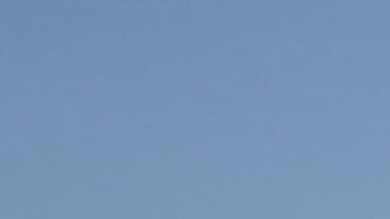 California Highway Patrol officer, Matthew Musselmann stops a motorist on Interstate 5 freeway who is suspected of speeding on Interstate 5 freeway for speeding Thursday, April 23, 2020, in Anaheim, Calif. The CHP is issuing a lot more tickets to motorists where lanes are wide open during the coronavirus pandemic. From March 19, when the stay-at-home order began, through April 19, officers issued 87% more citations to drivers suspected of speeding in excess of 100 mph. That's compared to the same period last year. The jump in speeding tickets coincides with a 35% decline in traffic volume. (AP Photo/Chris Carlson)