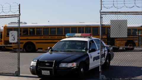 Los Angeles School District police patrols the district's bus garage in Gardena, Calif., Tuesday, Dec. 15, 2015. The nation's two biggest school systems, New York City and Los Angeles, received threats of a large-scale attack Tuesday, and L.A. reacted by shutting down the entire district. New York dismissed the warning as an amateurish hoax and held class as usual. In LA, the threat came in the form of an email to a school board member that raised fears of another attack like the recent deadly shooting in nearby San Bernardino. (AP Photo/Damian Dovarganes)