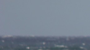 A Los Angeles County Lifeguard patrols the beach as winds whip up whitecaps and rough surf in Santa Monica Bay off El Segundo, Calif., Sunday, Nov. 27, 2016. The National Weather Service is warning travelers about heavy winds and potential blowing snow on busy Interstate 5 in Southern California. (AP Photo/John Antczak)