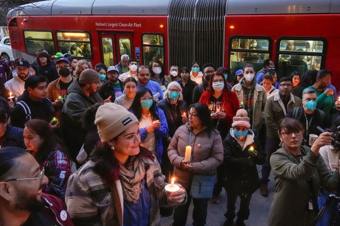 Members of the immigrant community lead by CHIRLA (Coalition for Humane Immigrant Rights) hold a community vigil to defend immigrant rights, outside the Immanuel Presbyterian Church in Los Angeles, Tuesday, Jan. 21, 2025. (AP Photo/Damian Dovarganes)