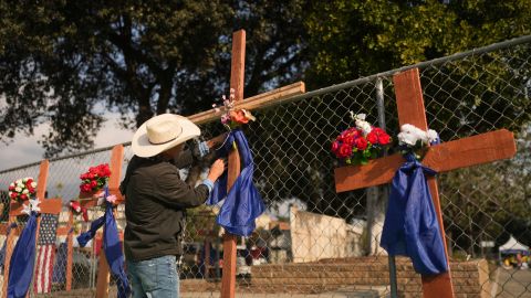 Crosses are placed on a fence in honor of victims of the Eaton Fire Friday, Jan. 17, 2025 in Pasadena, Calif. (AP Photo/Jae C. Hong)