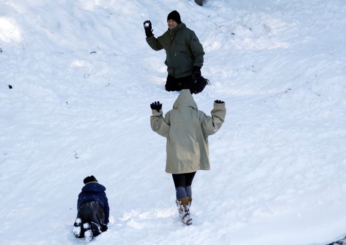 Visitors play in the snow Friday, Feb. 22, 2019, in Wrightwood, Calif. A winter storm swept through the Southwest and brought a rare snowfall to the Las Vegas Strip and the mountains above Malibu in California. (AP Photo/Marcio Jose Sanchez)