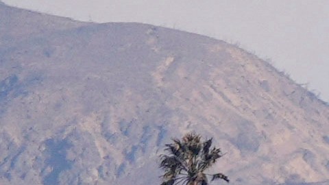 Properties damaged by the Palisades Fire are seen from a coastline perspective in the Pacific Palisades neighborhood of Los Angeles, Friday, Jan. 17, 2025. (AP Photo/Carolyn Kaster)