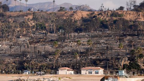 Properties damaged by the Palisades Fire are seen from a coastline perspective in the Pacific Palisades neighborhood of Los Angeles, Friday, Jan. 17, 2025. (AP Photo/Carolyn Kaster)