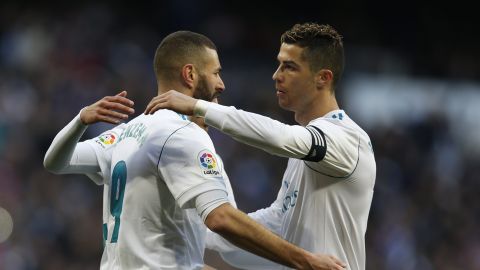 Real Madrid's Karim Benzema, left, celebrates with teammate Cristiano Ronaldo after scoring their side's fourth goal against Alaves during the Spanish La Liga soccer match between Real Madrid and Alaves at the Santiago Bernabeu stadium in Madrid, Saturday, Feb. 24, 2018. Ronaldo scored twice and Benzema once in Real Madrid's 4-0 victory. (AP Photo/Francisco Seco)