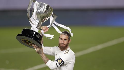 Real Madrid's captain Sergio Ramos lifts the trophy as he celebrates after winning the Spanish La Liga 2019-2020 following a soccer match between Real Madrid and Villareal at the Alfredo di Stefano stadium in Madrid, Spain, Thursday, July 16, 2020. (AP Photo/Bernat Armangue)