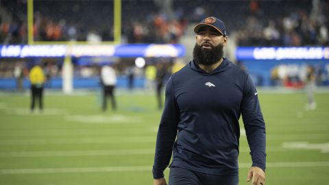 Denver Broncos outside linebacker coach Michael Wilhoite walks back to the locker room after an NFL football game against the Los Angeles Chargers, Sunday, Dec. 10, 2023, in Inglewood, Calif. (AP Photo/Kyusung Gong)