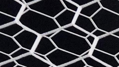 Assistant referee Fabrini Costa of Brazil checks the goal net before the start of the men's Group D soccer match between Japan and Mali at the Bordeaux stadium during the 2024 Summer Olympics, Saturday, July 27, 2024, in Bordeaux, France. (AP Photo/Moises Castillo)