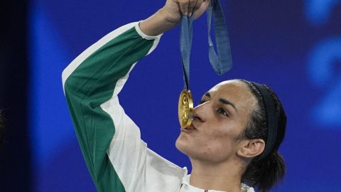 FILE - Gold medalist Algeria's Imane Khelif kisses her medal for the women's 66 kg final boxing match at the 2024 Summer Olympics, Friday, Aug. 9, 2024, in Paris, France. (AP Photo/John Locher, File)