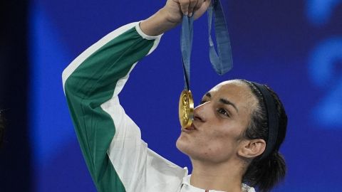 FILE - Gold medalist Algeria's Imane Khelif kisses her medal for the women's 66 kg final boxing match at the 2024 Summer Olympics, Friday, Aug. 9, 2024, in Paris, France. (AP Photo/John Locher, File)