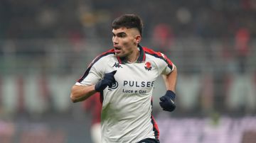 Genoa's Johan Vasquez runs during the Serie A soccer match between AC Milan and Genoa at the San Siro stadium, in Milan, Italy, Sunday, Dec. 15, 2024. (AP Photo/Antonio Calanni)