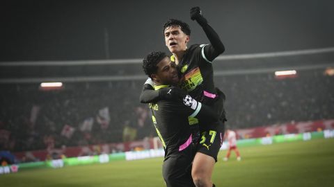PSV's Ryan Flamingo, left, celebrates with PSV's Richard Ledezma after scoring his side's third goal during the Champions League opening phase soccer match between Red Star and PSV at the Rajko Mitic Stadium in Belgrade, Serbia, Tuesday, Jan. 21, 2025. (AP Photo/Darko Vojinovic)