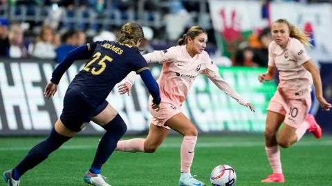 FILE - Angel City FC defender Gisele Thompson dribbles away Seattle Reign defender Shae Holmes (25) during the second half of an NWSL soccer match Friday, Oct. 4, 2024, in Seattle. (AP Photo/Lindsey Wasson, File)