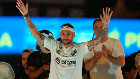 Brazilian soccer player Neymar waves to fans during his presentation ceremony after signing a six-month contract with Santos FC at Vila Belmiro Stadium in Santos, Brazil, Friday, Jan. 31, 2025. (AP Photo/Andre Penner)