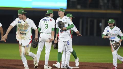 Mexico's players celebrate after their team defeated Puerto Rico during a Caribbean Series baseball game at Nido de los Aguilas stadium in Mexicali, Mexico, Friday, Jan. 31, 2025. (AP Photo/Fernando Llano)