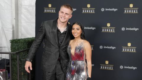 Arizona Cardinals Trey McBride poses with flag football player Diana Flores of Mexico on the red carpet before the NFL Honors award show ahead of the Super Bowl 59 football game, Thursday, Feb. 6, 2025, in New Orleans. (AP Photo/Doug Benc)