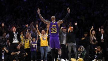 Los Angeles Lakers forward LeBron James celebrates with fans after defeating the Golden State Warriors, during an NBA basketball game Thursday, Feb. 6, 2025, in Los Angeles. (AP Photo/Kevork Djansezian)