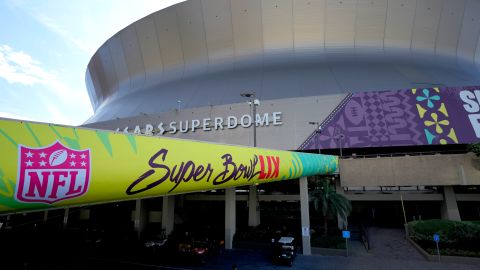 FILE - A lone security guard walks outside the Caesars Superdome, Jan. 31, 2025, in New Orleans ahead of the NFL Super Bowl 59 football game between the Philadelphia Eagles and the Kansas City Chiefs. (AP Photo/Matt York, File)