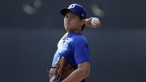 Los Angeles Dodgers' Shohei Ohtani, of Japan, runs drills during a baseball spring training workout, Friday, Feb. 14, 2025, in Phoenix. (AP Photo/Matt York)