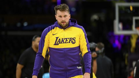 Los Angeles Lakers guard Luka Doncic looks on before an NBA basketball game against the Charlotte Hornets, Wednesday, Feb. 19, 2025, in Los Angeles. (AP Photo/William Liang)