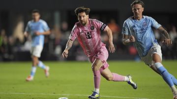 Inter Miami forward Lionel Messi, left, and New York City FC defender Birk Risa (5) vie for the ball during the first half of an MLS soccer match, Saturday, Feb. 22, 2025, in Fort Lauderdale, Fla. (AP Photo/Rebecca Blackwell)