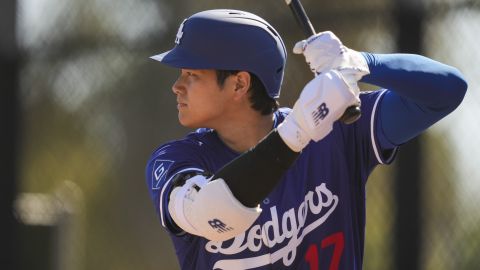 Los Angeles Dodgers two-way player Shohei Ohtani works out during a spring training baseball practice, Wednesday, Feb. 26, 2025, in Phoenix. (AP Photo/Ashley Landis)