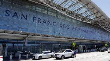 FILE - Vehicles wait outside the international terminal at San Francisco International Airport in San Francisco on July 11, 2017. A worker at the airport was stabbed Tuesday, July 19, 2022, and a suspect was in custody, police said. It is the latest in a series of security incidents at the airport south of San Francisco. (AP Photo/Marcio Jose Sanchez, File)