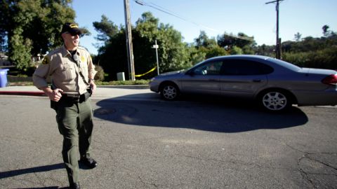 A San Diego County sheriff deputy blocks the road leading to a home in a hilly neighborhood of Escondido, Calif. where authorities recently found the largest supply of homemade explosives in a single location in United States history, Wednesday, Dec. 1, 2010. The home was rented and occupied by a George Djura Jakubec and is scheduled to be burned next week. (AP Photo/Lenny Ignelzi)