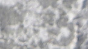 A snow-covered vehicle drives along Highway 330 near Big Bear Lake, Calif., Tuesday, Dec. 8, 2009. (AP Photo/Jae C. Hong)