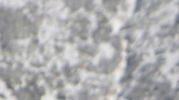 A snow-covered vehicle drives along Highway 330 near Big Bear Lake, Calif., Tuesday, Dec. 8, 2009. (AP Photo/Jae C. Hong)