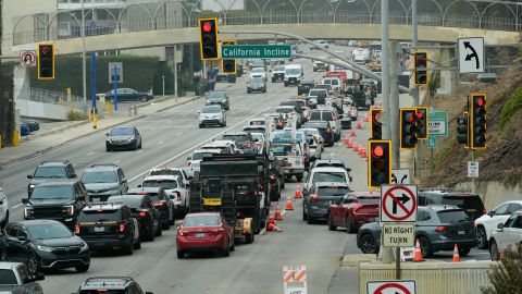 Motorists line up along Pacific Coast Highway near the Palisades Fire zone Monday, Feb. 3, 2025, in Santa Monica, Calif. (AP Photo/Damian Dovarganes)