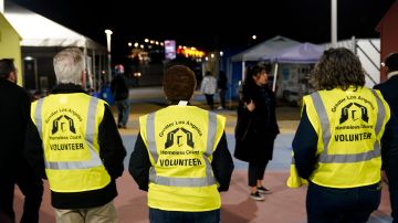 From left to right, City councilman Paul Krekorian, left, Mayor Karen Bass, and LA Family Housing CEO Stephanie Klasky-Gamer participate in the city's annual homeless count in the North Hollywood section of Los Angeles Tuesday, Jan. 24, 2023. Thousands of clipboard-toting volunteers with the LA Homeless Services Authority fanned out across the county Tuesday night for the effort's main component, the unsheltered street tally. (AP Photo/Marcio Jose Sanchez)